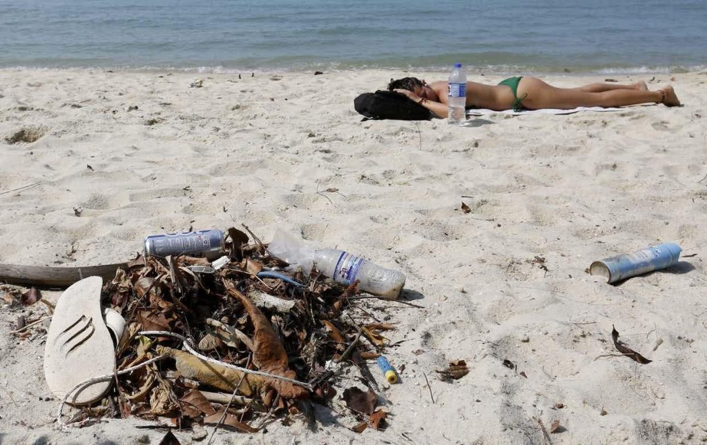 Discarded plastic bottles everywhere on the beach